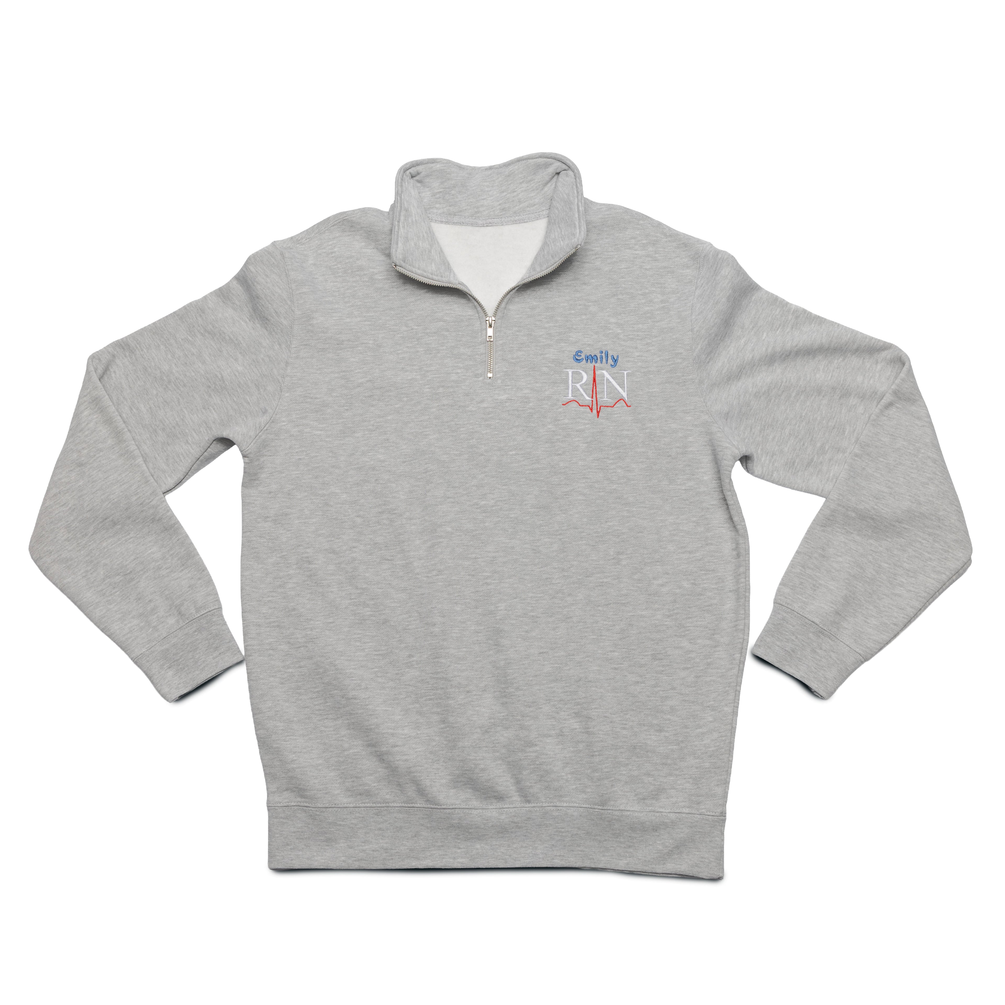 Grey Heather quarter-zip laid flat with a custom name and the RN design embroidered on the chest
